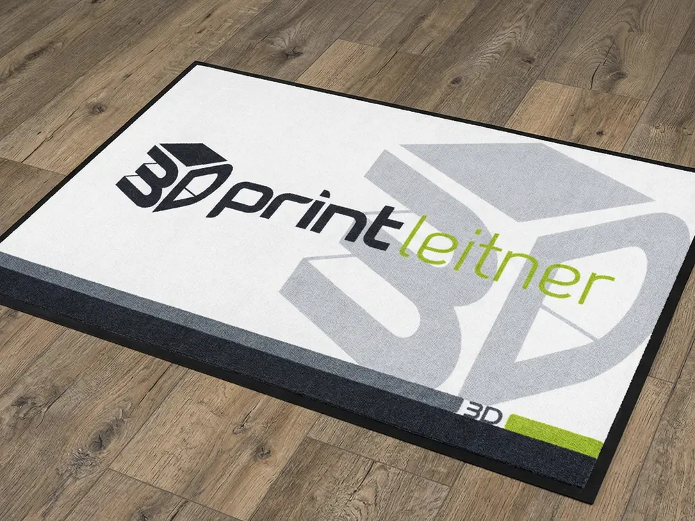 Individuell bedruckte Indoor-Fußmatten für den Businessbereich auf 100% Premium-Velours mit rutschfestem Gummirücken.